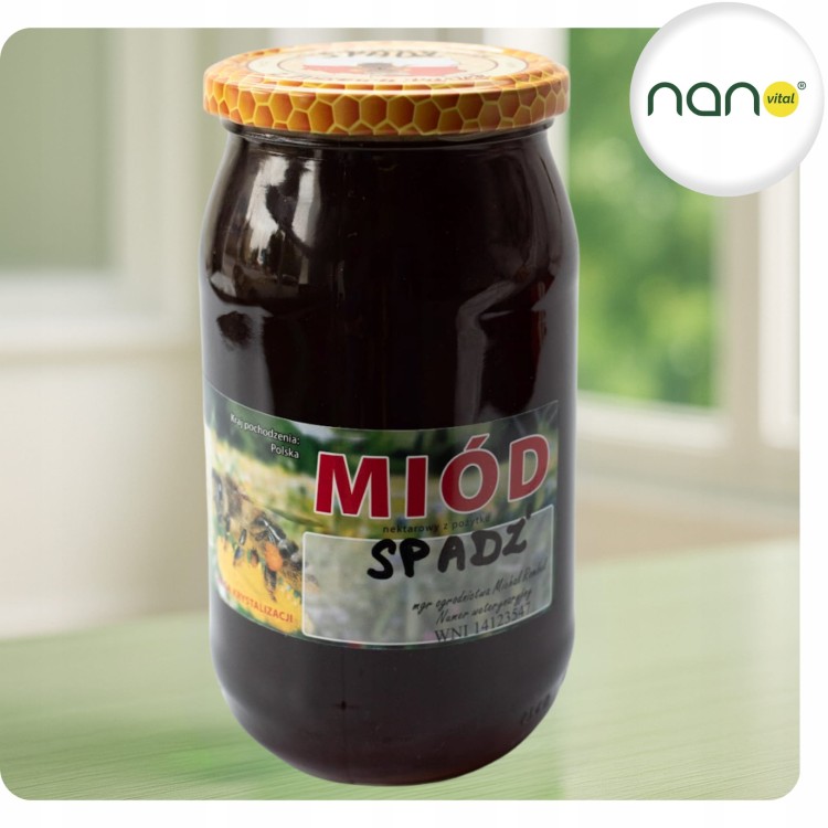 Duży szklany słoik 1100 g czystego miodu nektarowo-spadziowego, naturalnego produktu pszczelego, z wyraźną etykietą.